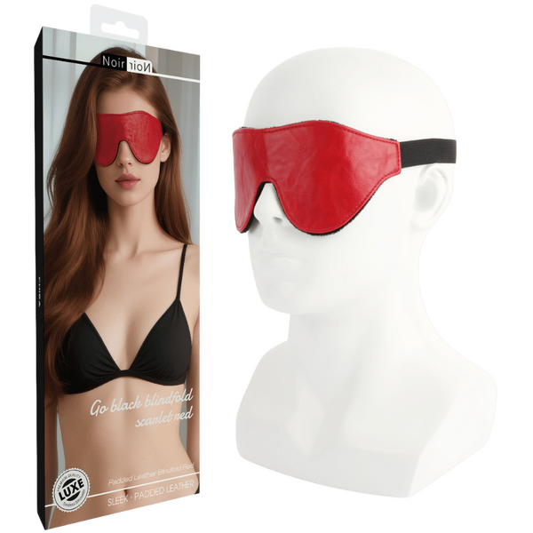 Red sleep mask on a mannequin head with packaging displaying a woman wearing it.